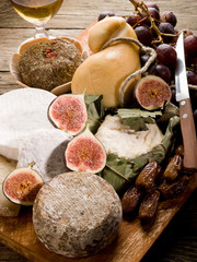 cheeseboard  with an assortment of cheeses and fruits