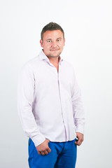 Portrait of handsome young man smiling over white background wit