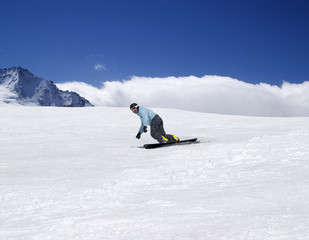 Snowboarding in mountains