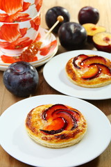 Puff pastry with cream  and plums.