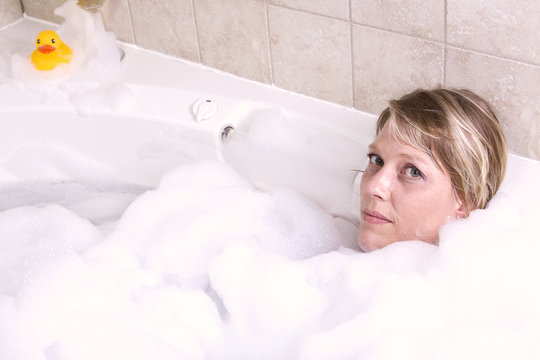 Woman Relaxing in the Tub
