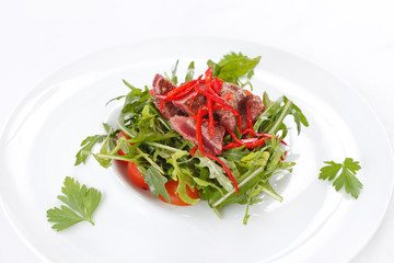 salad with arugula and beef
