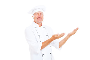 smiley senior cook showing something