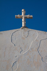 White cross on the top of chapel