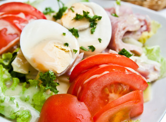 Delicious fresh salad and olive oil