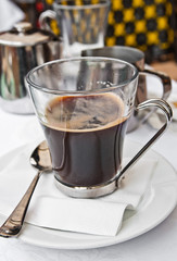 wonderful white cup of hot coffee on table