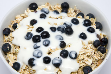 Bowl of muesli with yogurt and blueberries