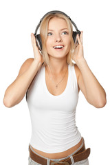 Beautiful female listening the music in headphones