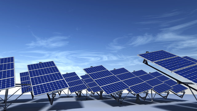 Field of articulated solar panels with blue sky in morning