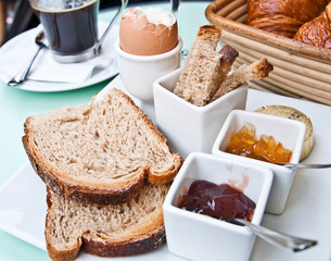 Breakfast with orange juice and fresh fruits on table