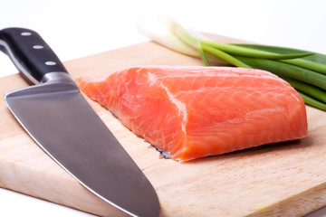 salmon pieces on a chopping board