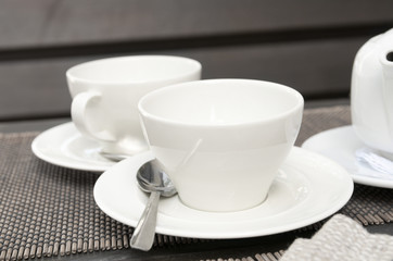 Two cups and teappot on the table