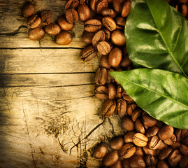 Coffee Beans over Wood Background