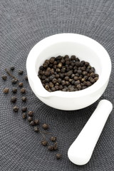 ceramic mortar and black pepper