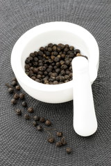 ceramic mortar and black pepper
