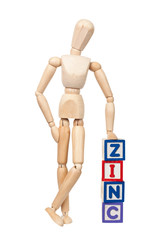Wooden figurine with the word Zinc isolated on white