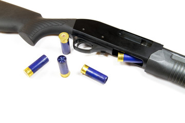 Shotgun rifle partial with some shells on white