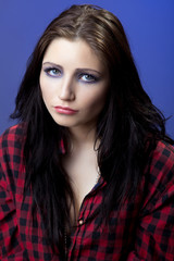 Young depressed girl in red shirt look with sad