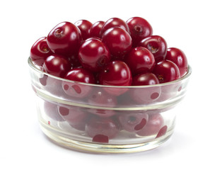 Bowl with ripe cherries. Isolated on a white background.