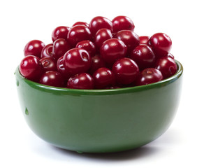 Bowl with ripe cherries. Isolated on a white background.