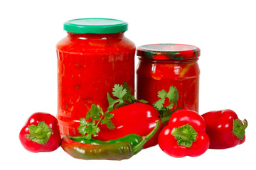 Home canned vegetables in glass jars and peppers