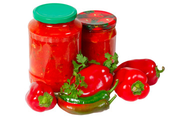 Home canned vegetables in glass jars and peppers
