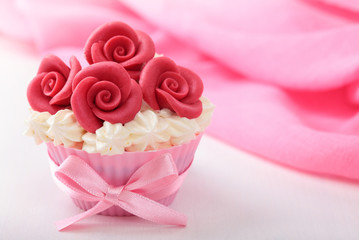 Cup cake with red marzipan roses