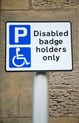 disbaled sign on brick background