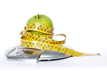 Mela verde, bilancia e metro, dieta, salute, alimentazione