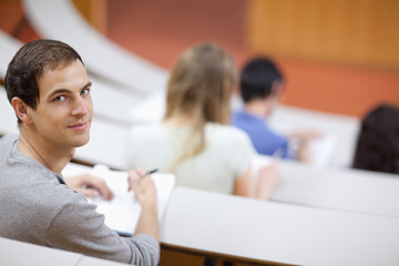 Smiling student being distracted