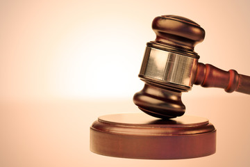 Brown gavel and scale of justice