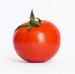closeup of one red tomato on white background