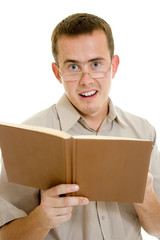 The man in glasses with a book.