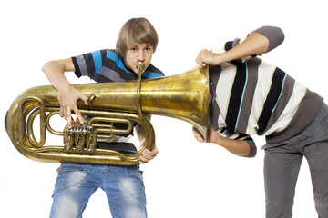 Fun boys enjoy with a trumpet