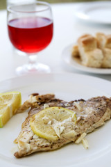 Gilt-head bream with wine and baguette