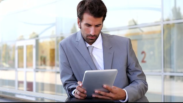 Businessman on business travel using tablet