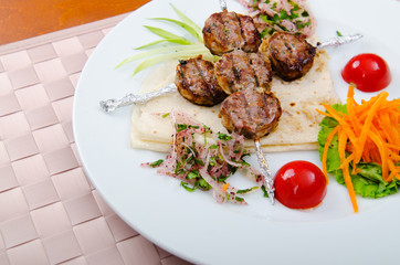 Meat cuisine - kebab served in plate