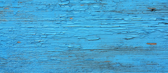 Closing on blue wooden panels of the fence
