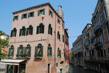 Fototapeta na wymiar Canal with ancient houses in Venice, Italy