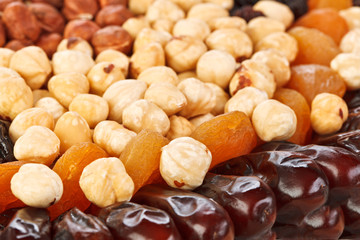 Dried fruits food background with hazel, cashew nuts, figs and a