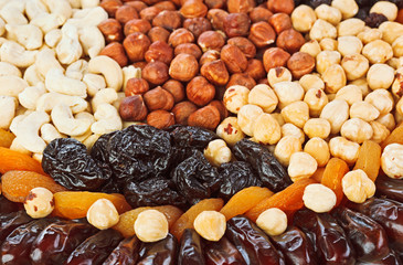 Dried fruits food background with hazel, cashew nuts, prunes, fi