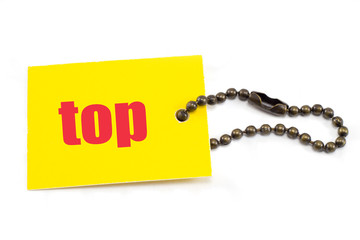 Yellow tag with chain showing top