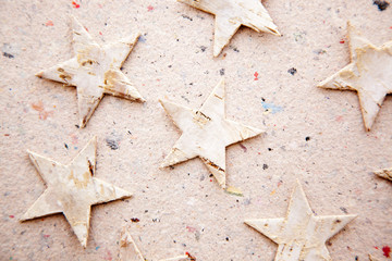 chritmas stars on recycled paper background