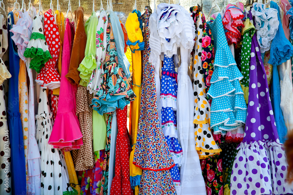 Wall mural colorful gipsy dresses in rack hanged in Spain