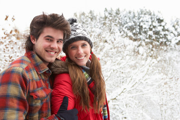 Fototapeta premium Young couple in snow
