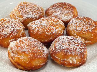 A Plate of Freshly Made Aebelskivers with Powdered Sugar