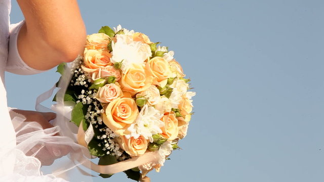 Bride and groom holding a bouquet