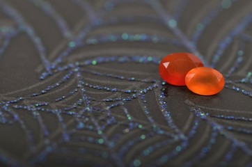 Orange Gems with spiderwebs - Powered by Adobe