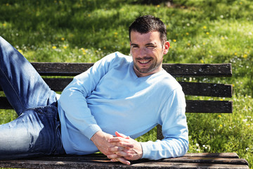 relaxed on a bench