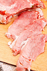 fresh beef on board ready to cook isolated on white